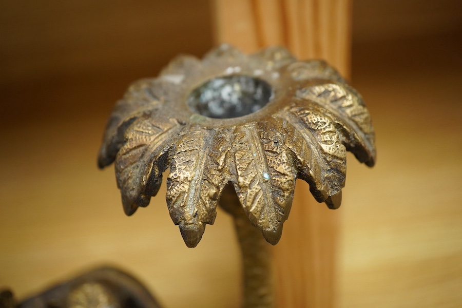 A brass two branch candleholder in the form of palm trees and monkeys, 22cm high. Condition - fair